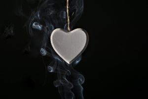 smoke curling around a heart ornament