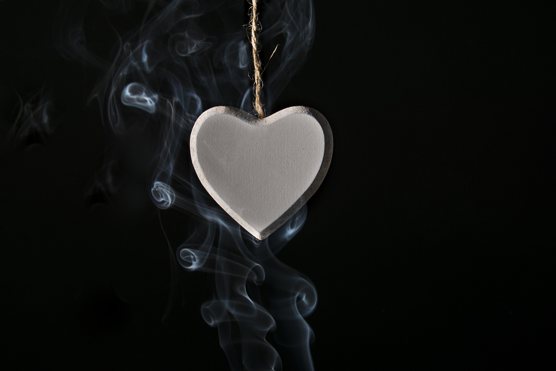 smoke curling around a heart ornament
