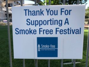 Sign saying thank you for supporting a smoke free festival