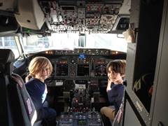 Kids in the cockpit of an airplane