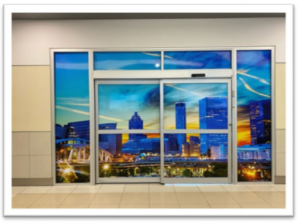 airport entry doors with reflection of city