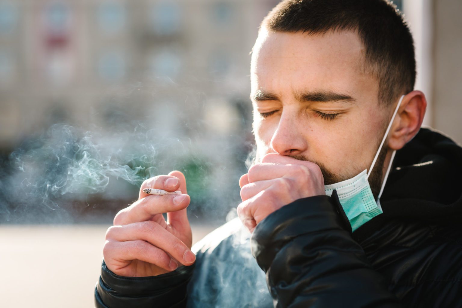 smoking-closeup-man-with-mask-during-covid-19-pandemic-coughing-and